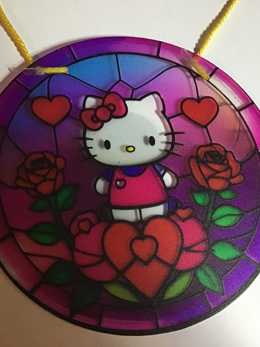 really cute hello kitty stained glass style design.  made of acrylic.  6 inches